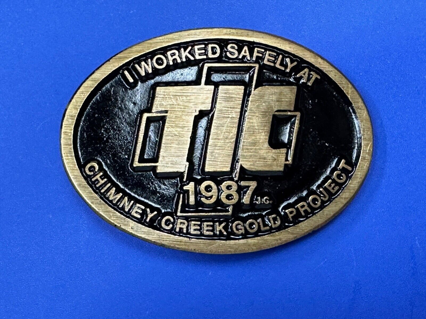 Vintage 1987 TIC Chimney Creek Gold Project Safety award brass belt buckle