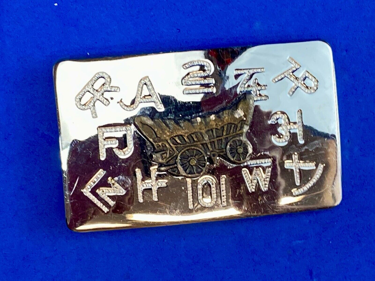 Vintage Chaimbers covered wagon western belt buckle with branding signs marks