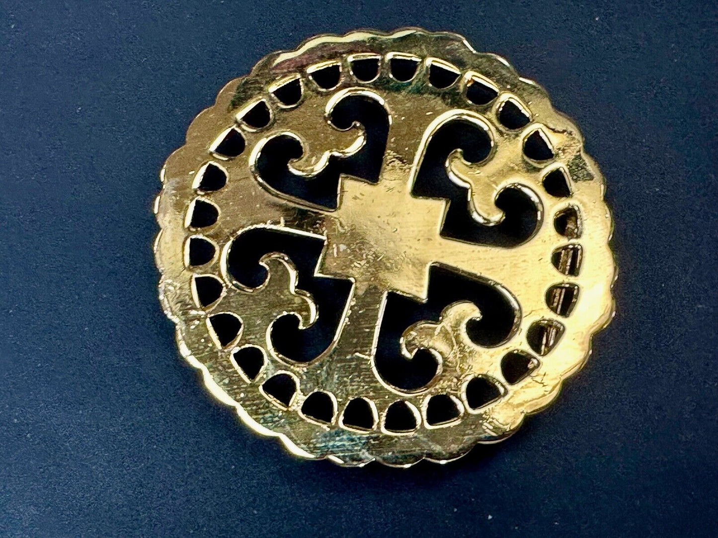 vintage Celtic pattern round cutout belt buckle by designer Ann Lansing