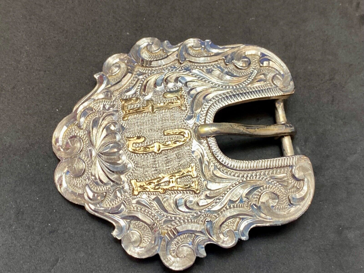 Vintage ACE Western cowboys flower swirl belt buckle design by DALE Chavez
