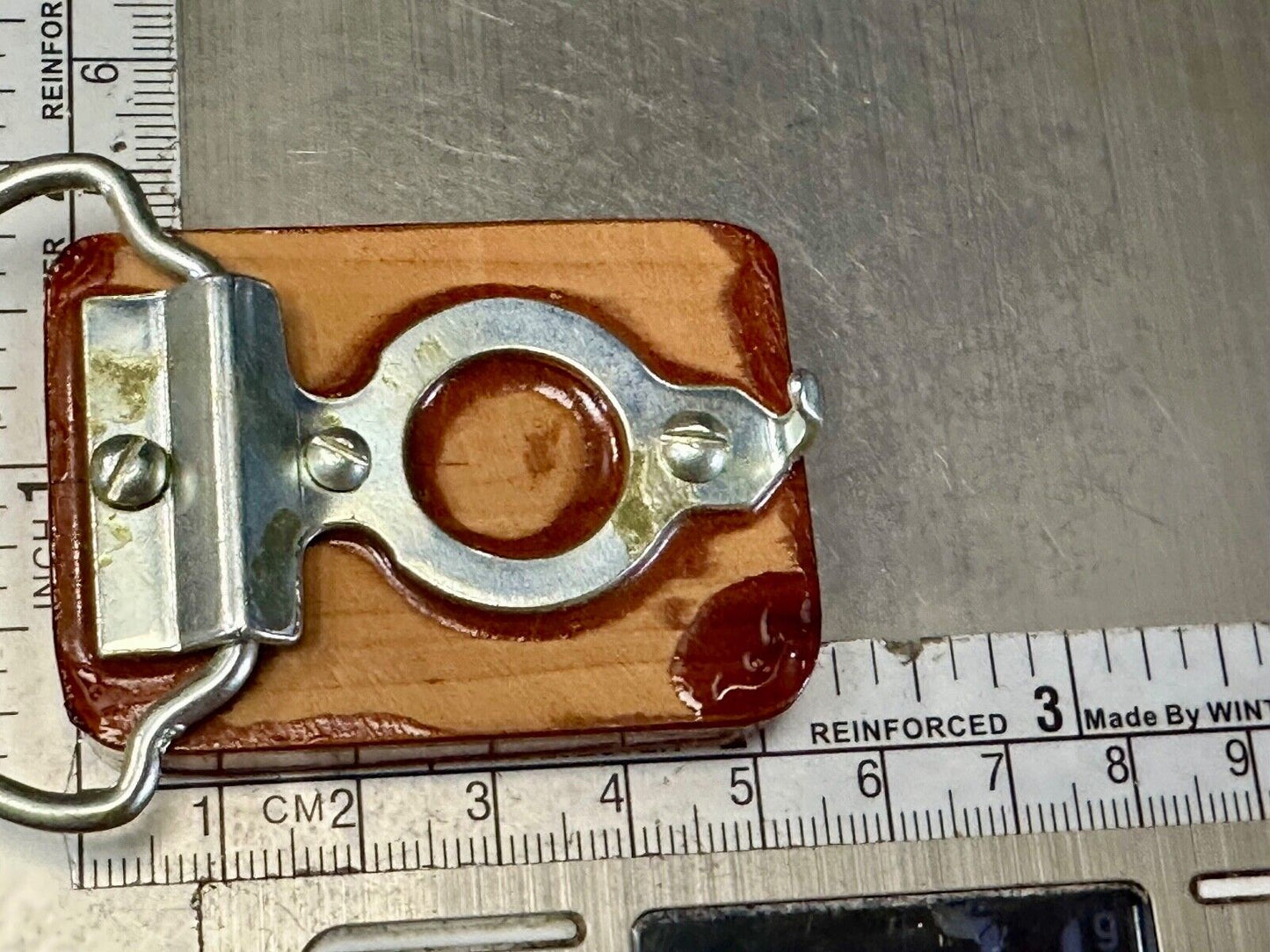 Artisan wood belt buckle with inlaid Luary Caverns cave token coin