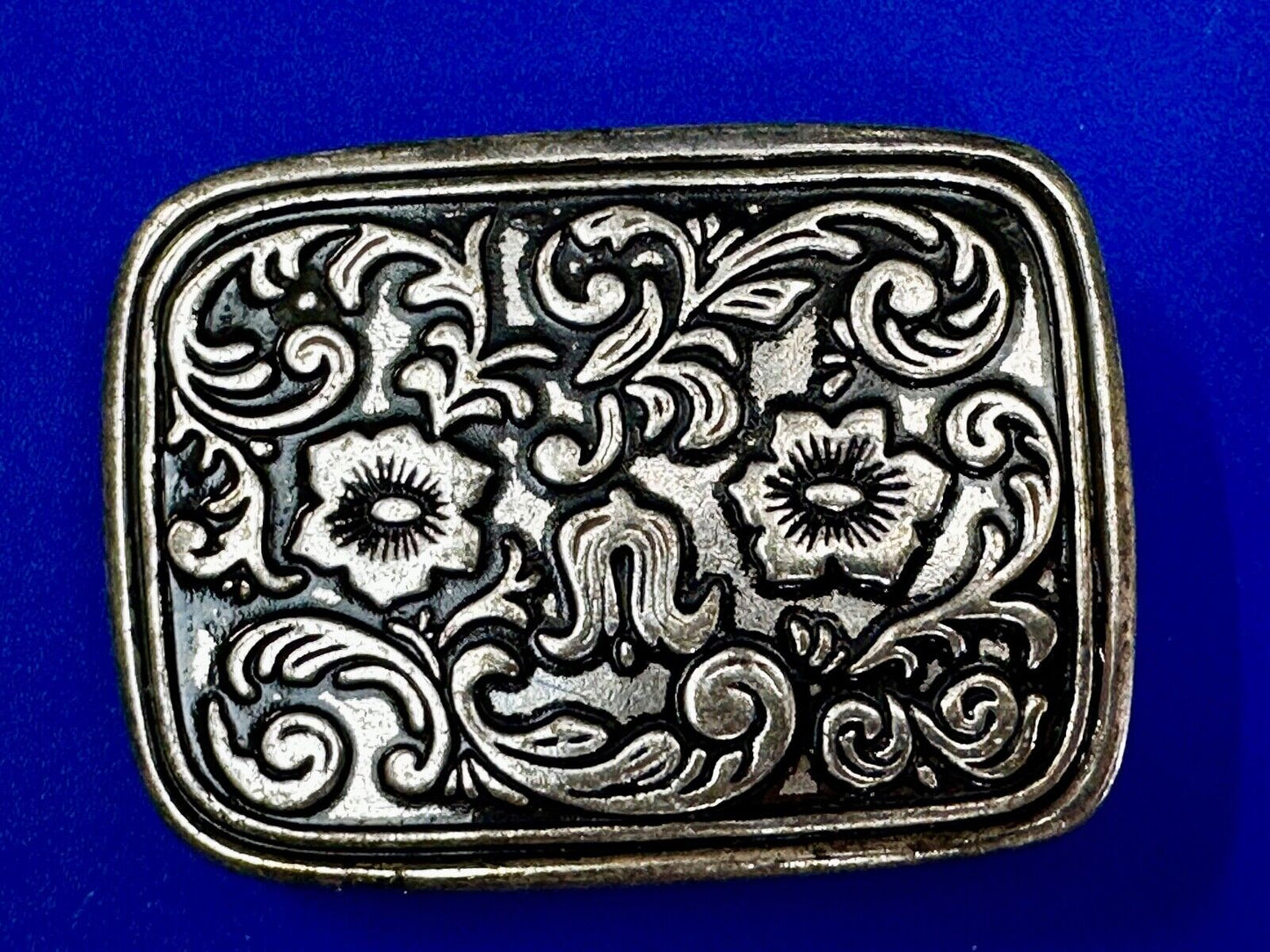 Vintage black and silver tone western flower floral theme cowboys belt buckle