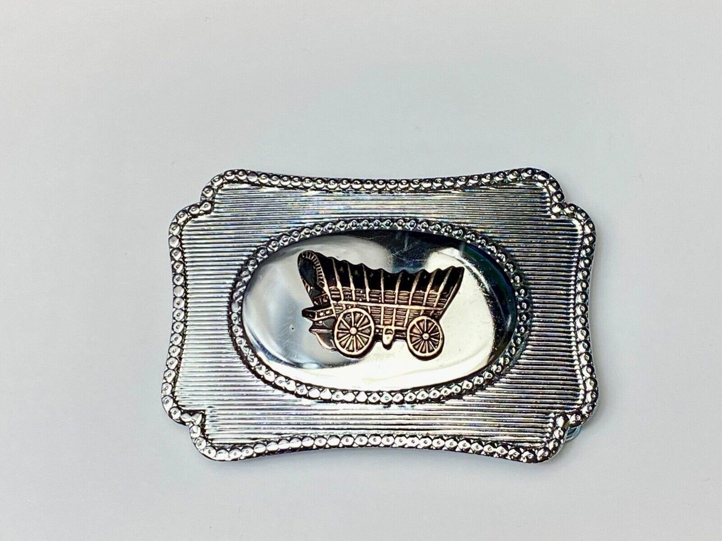 Vintage Covered wagon two tone reflective pre loved, western framed belt buckle