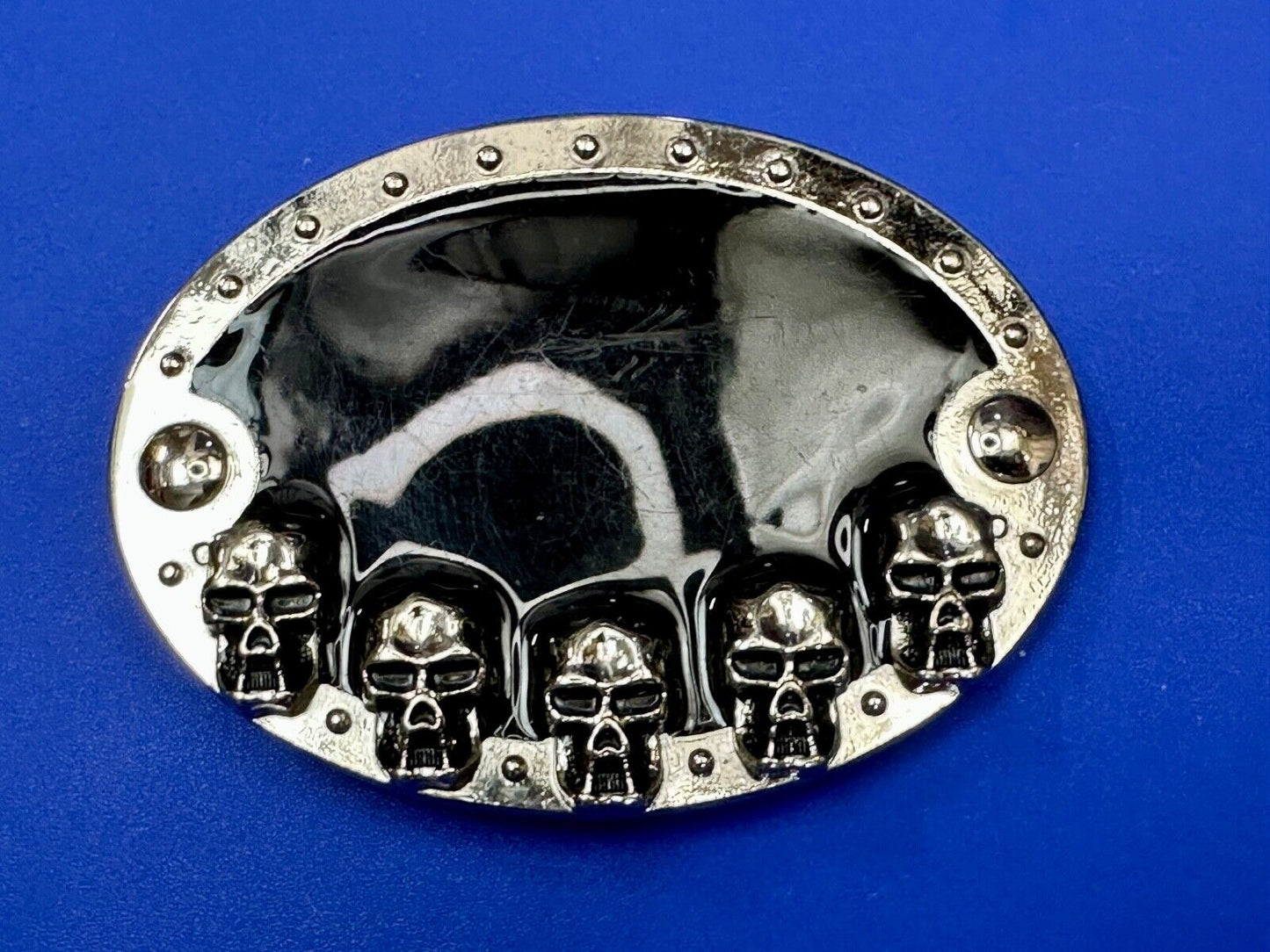 Black and silver Belt Buckle with multiple skulls on boarder