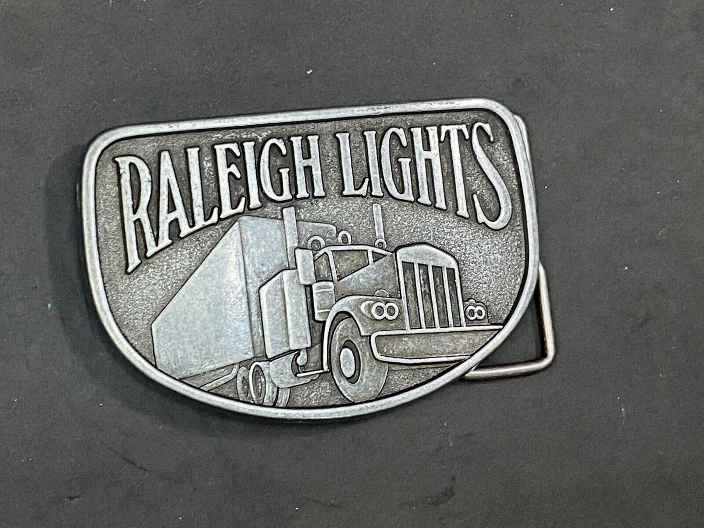 Vintage Belt Buckle Raleigh Lights Cigarette Trucker Trucking Cigarettes