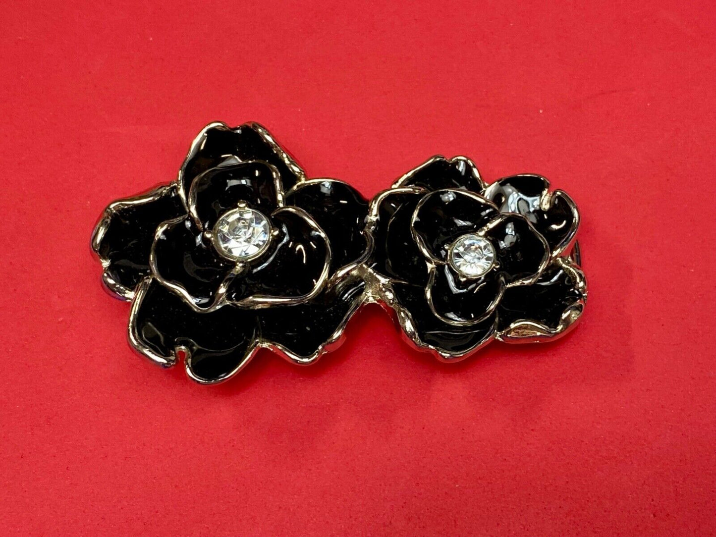 Beautiful two figural flowers with jewels as black & silver colored belt buckle