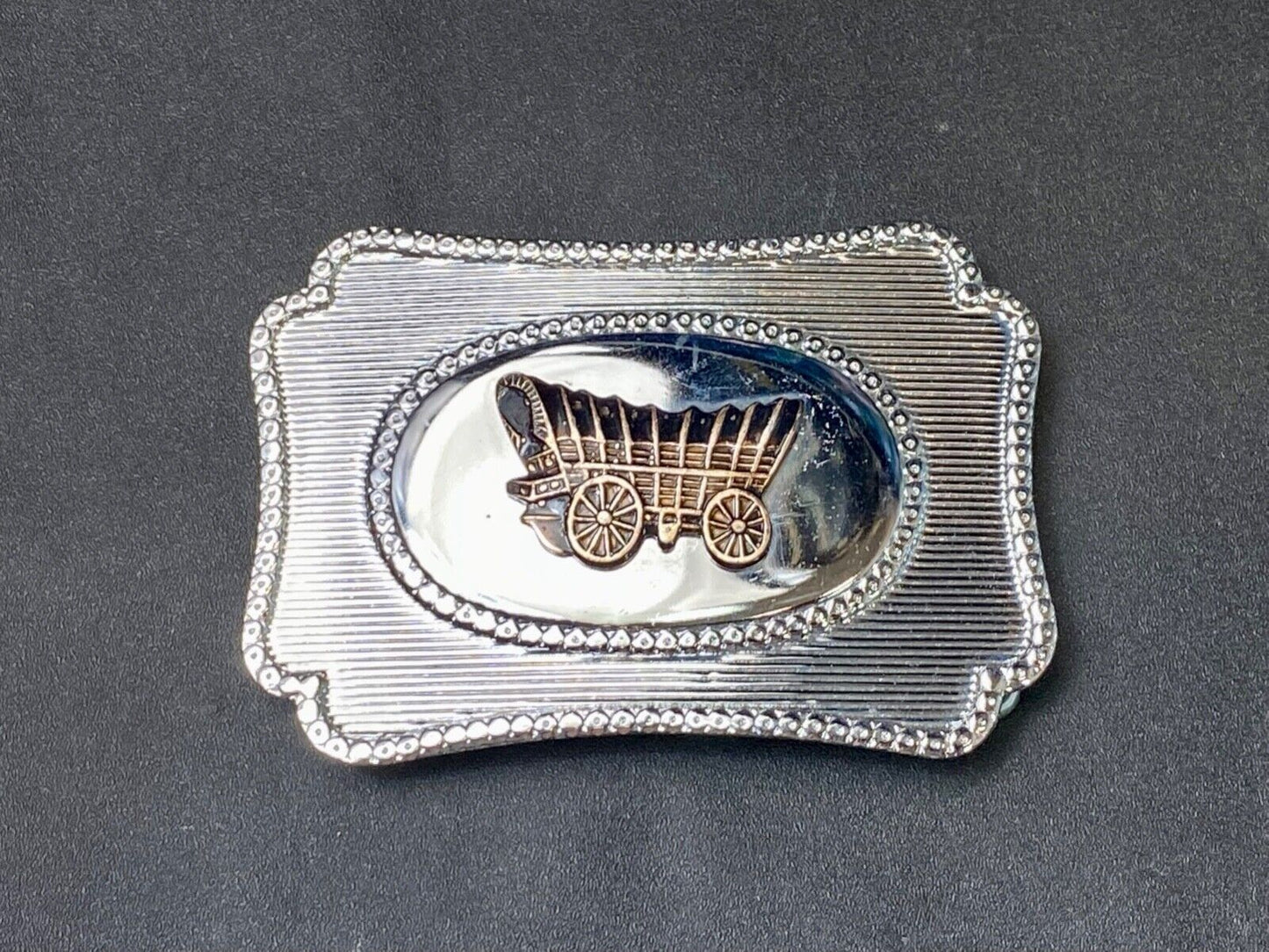 Vintage Covered wagon two tone reflective pre loved, western framed belt buckle