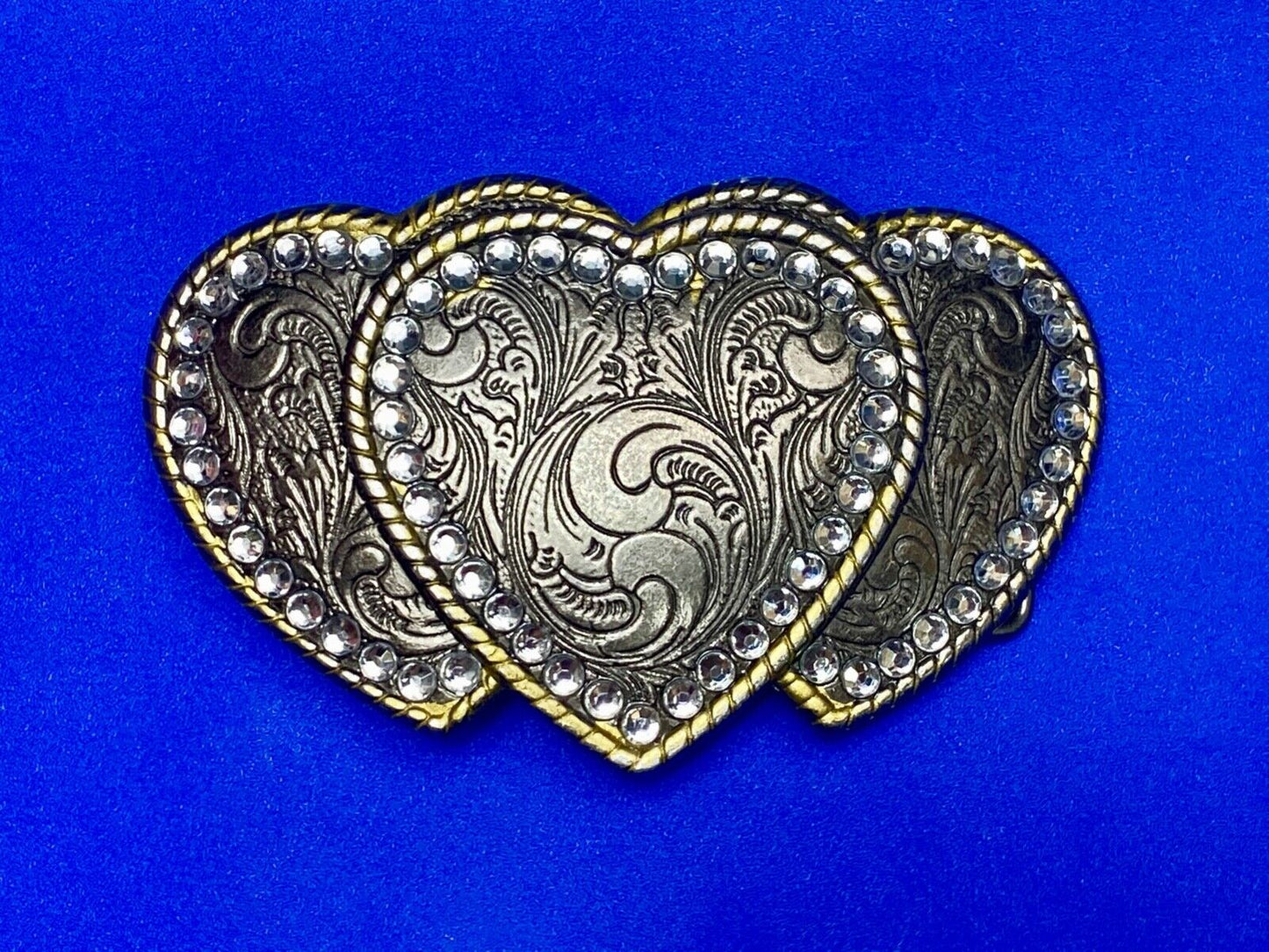 Three hearts ornate flower swirl belt buckle with thick rhinestone boarder