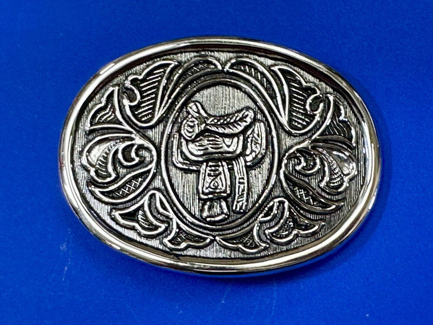 Vintage Cowboy's Horse Saddle ornate flower swirl oval belt buckle by Avon