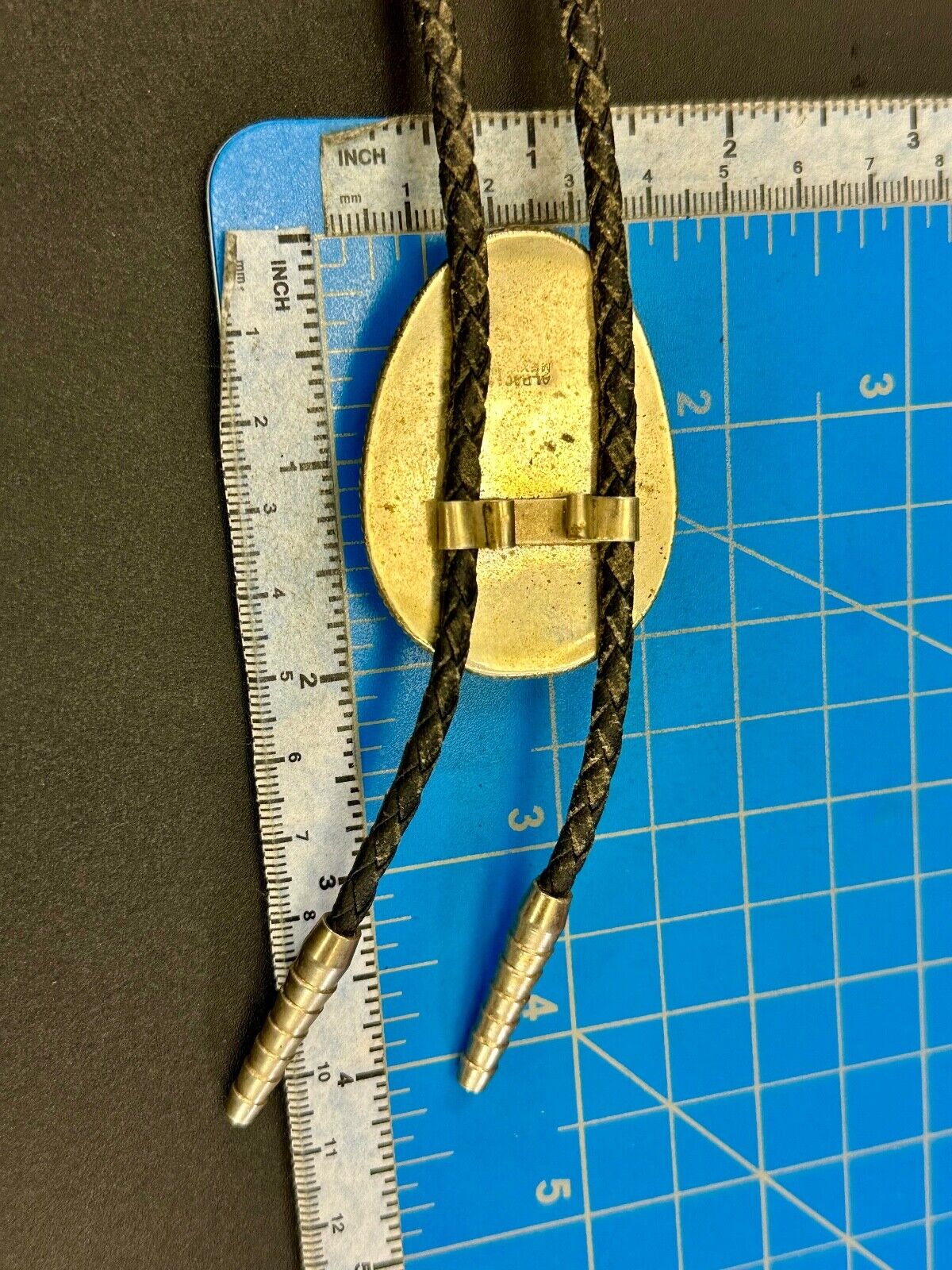 Beautiful Alpaca Mexico bolo tie with dimensional raised leaf's black stone