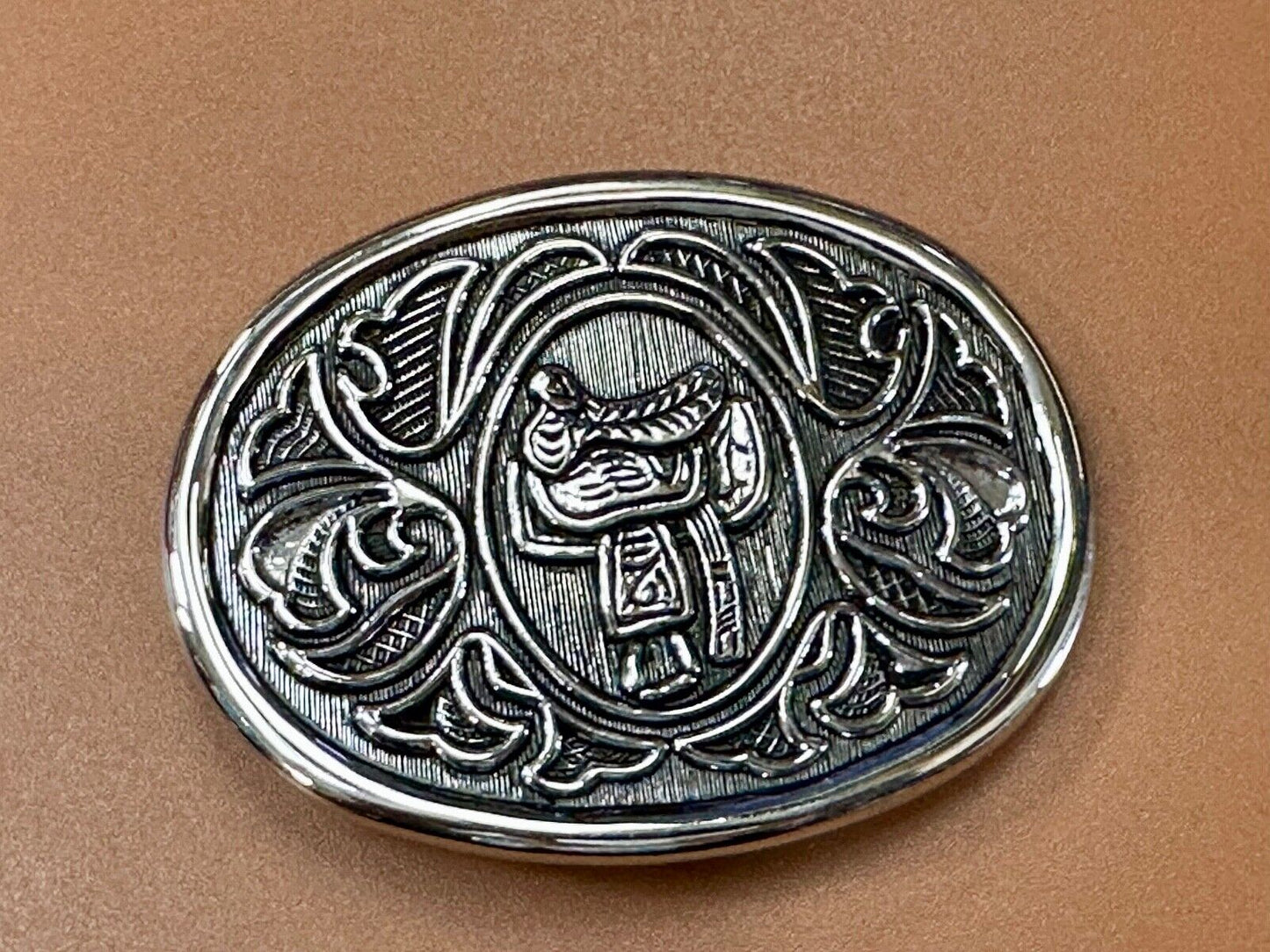 Vintage Cowboy's Horse Saddle ornate flower swirl oval belt buckle by Avon