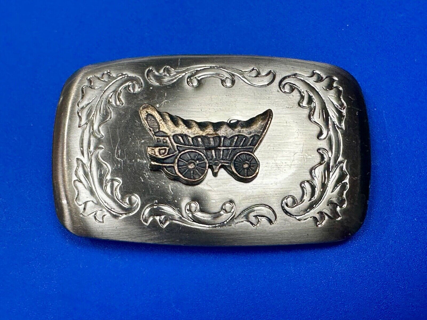Vintage covered wagon two tone western mixed metal belt buckle
