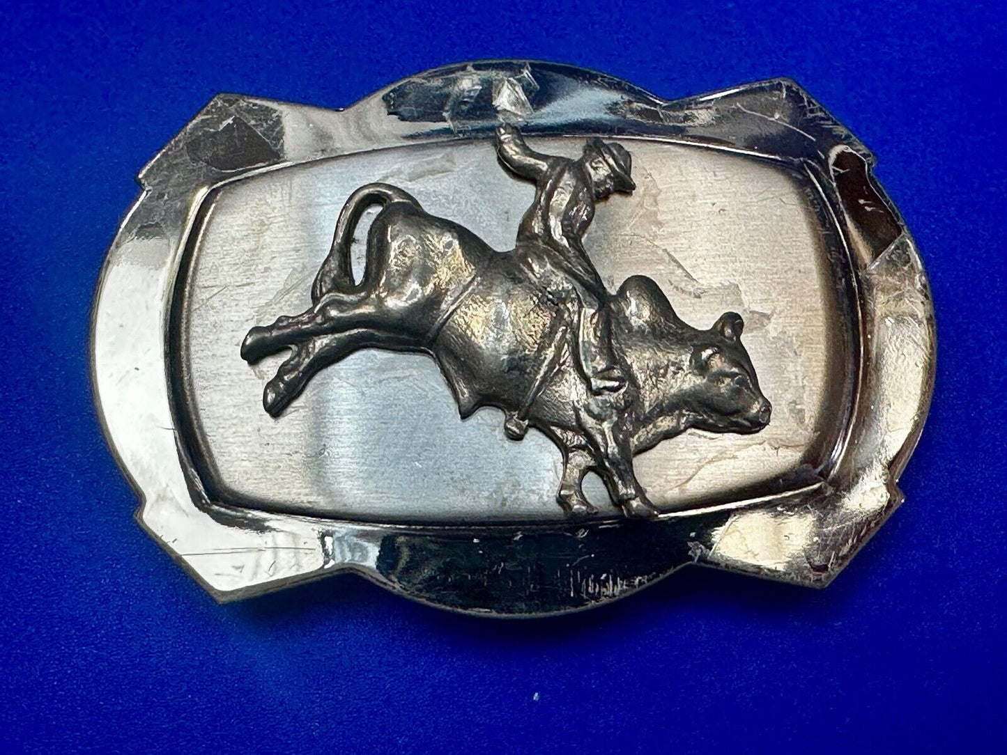 Vintage Cowboy Saddle Bronc on reflective two tone western belt buckle