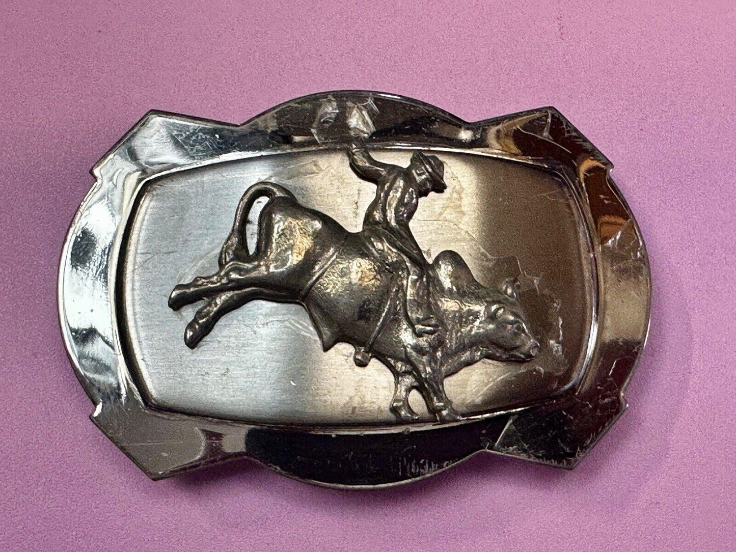 Vintage Cowboy Saddle Bronc on reflective two tone western belt buckle