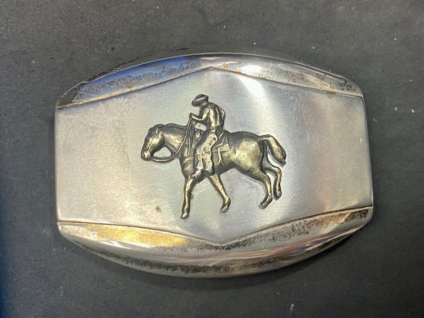 Vintage belt buckle Horseback old west cowboy riding the trail
