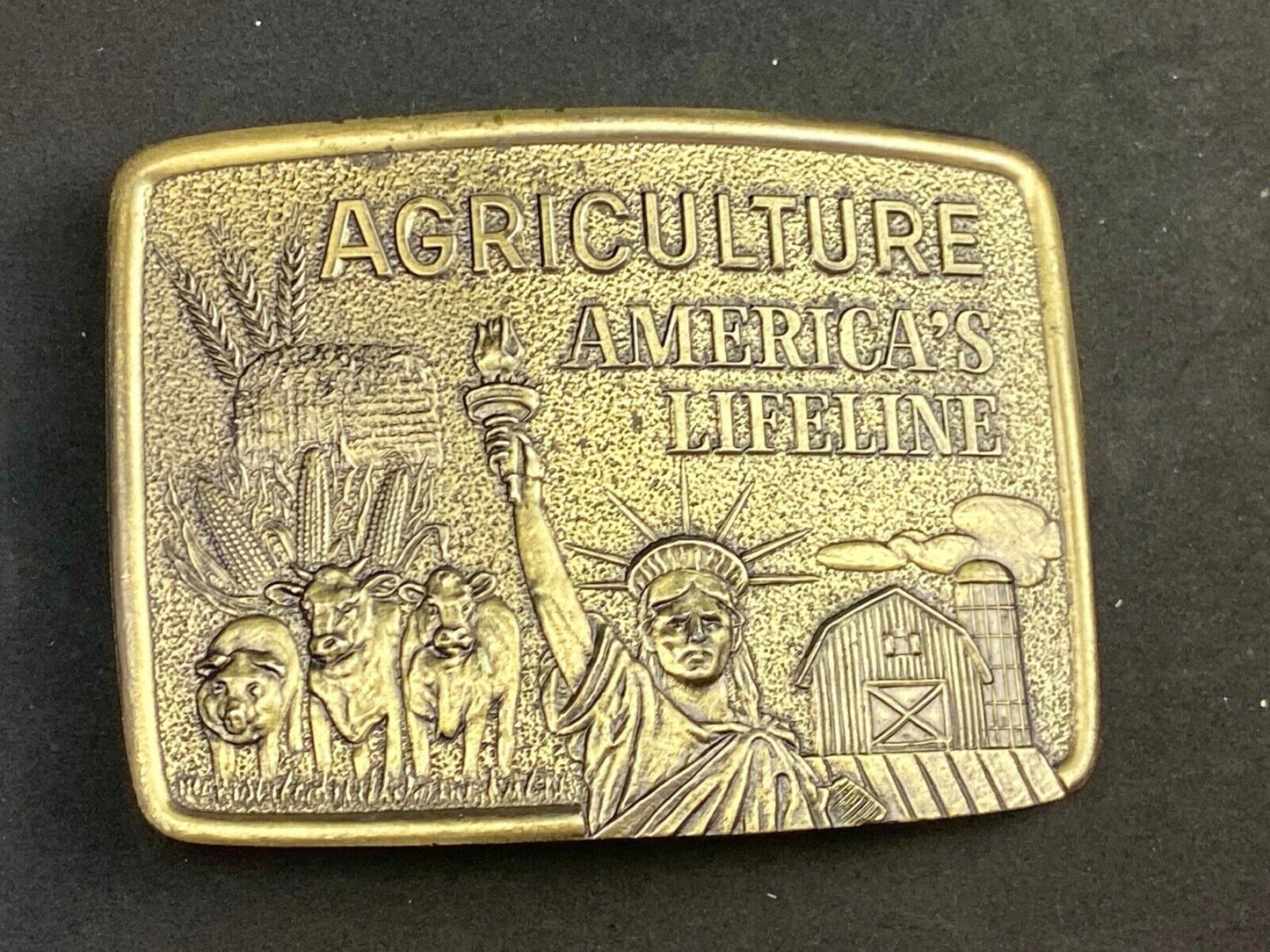 AGRICULTURE, Americas Lifeline belt buckle by Farmhand Statue of liberty
