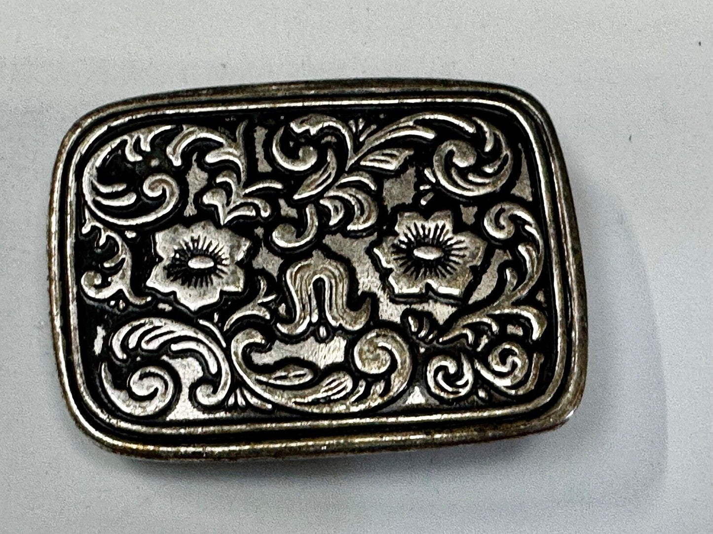 Vintage black and silver tone western flower floral theme cowboys belt buckle