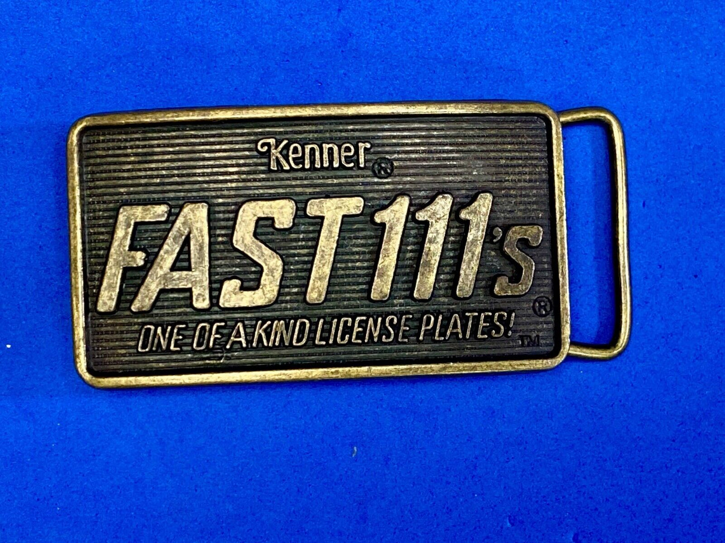 1982 Kenner Fast 111'S Company Advertisement Belt Buckle License Plates
