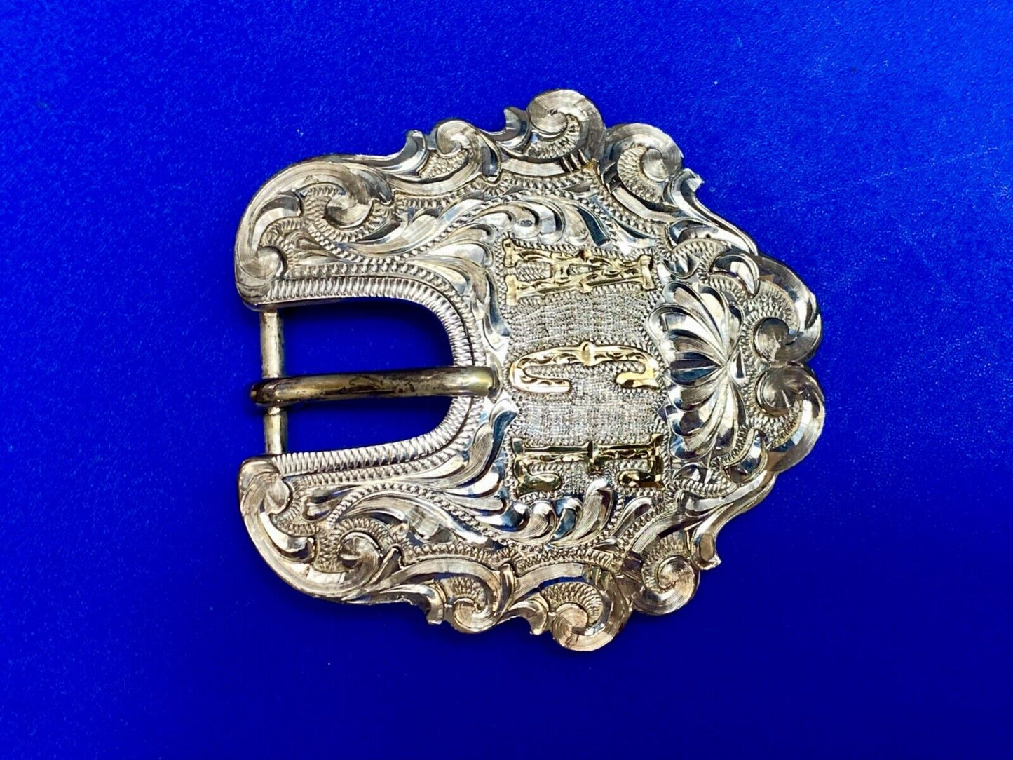 Vintage ACE Western cowboys flower swirl belt buckle design by DALE Chavez