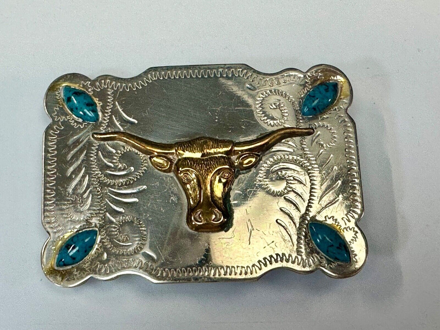 The Longhorn cow steer western nickel silver belt buckle with turquoise accents