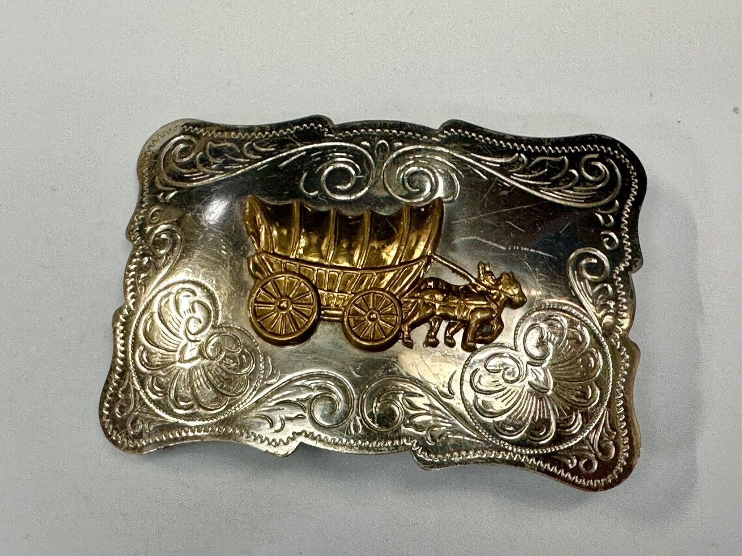 Vintage Covered Wagon two tone ornate cowboys out west flower swirl belt buckle