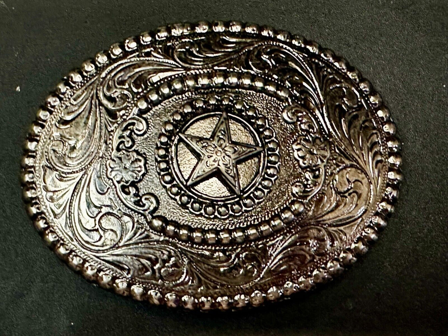 The Lone Star Centered In Oval Flower Swirl Silver Tone Belt Buckle