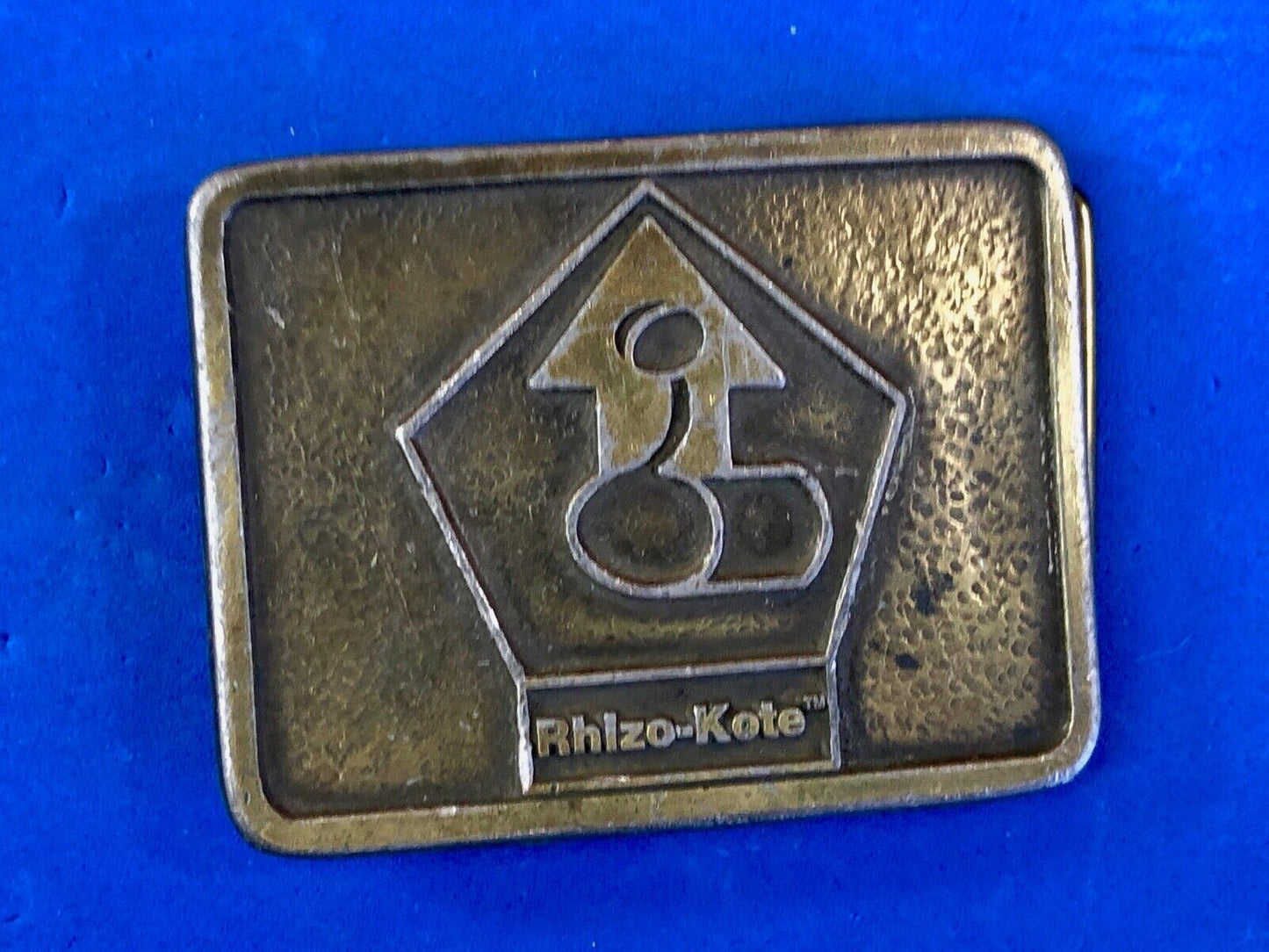 Vintage advertising Rhizo kote seal coating company belt buckle