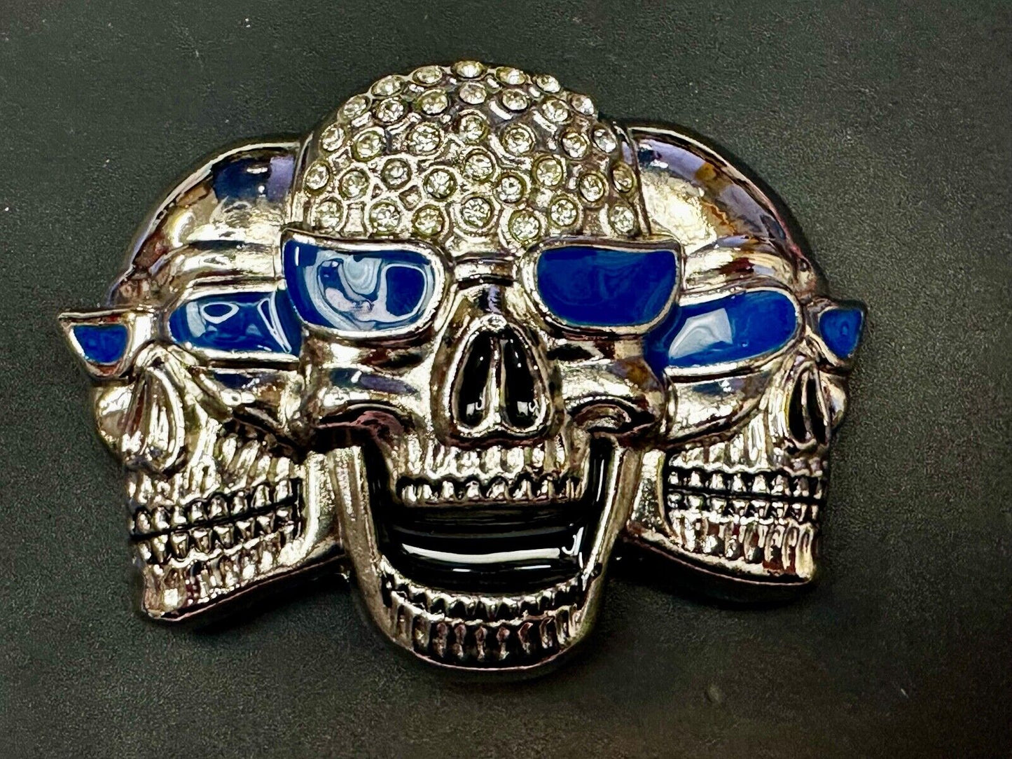 Three Skull's Heads Rhinestone Accented W/ Blue Shades Silver Tone Belt Buckle