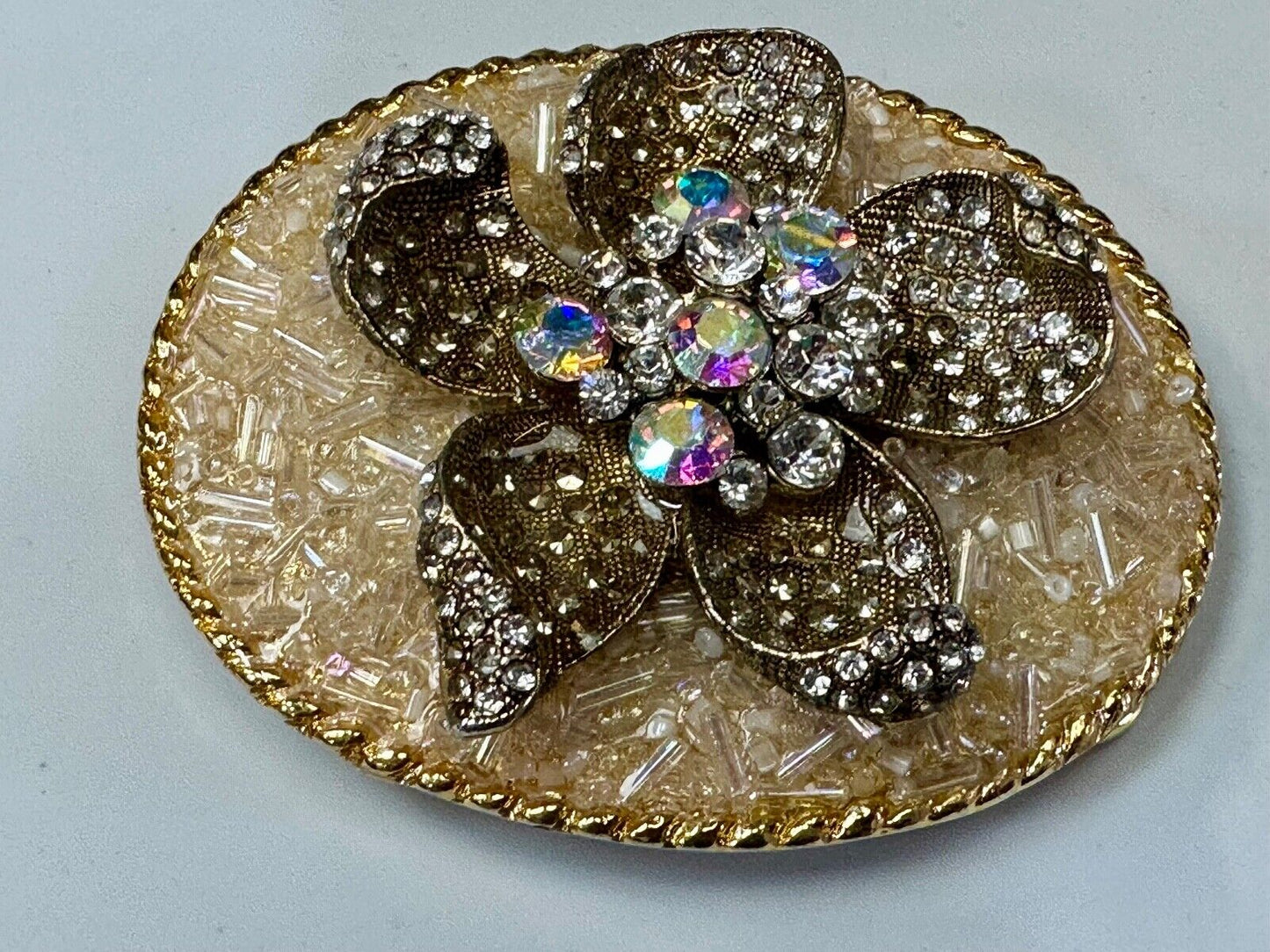Beautiful chunky goldtone flower centerpiece in rhinestone accented belt buckle