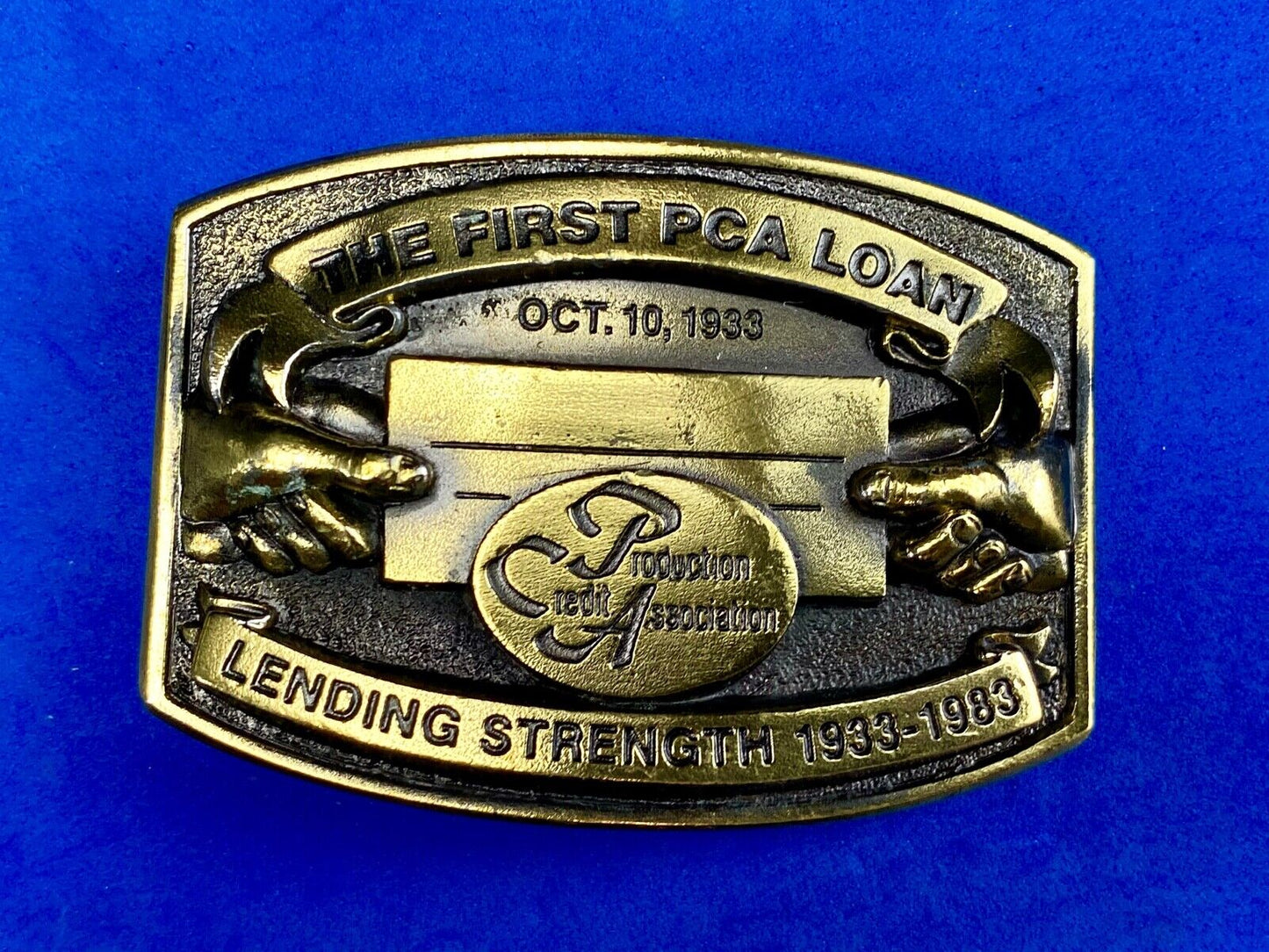 The First PCA loan Production Credit Assn. The Great American Belt Buckle Co