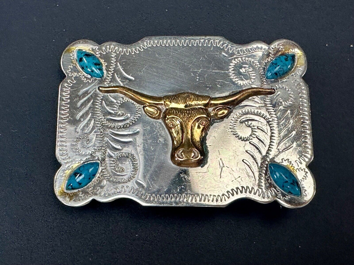 The Longhorn cow steer western nickel silver belt buckle with turquoise accents