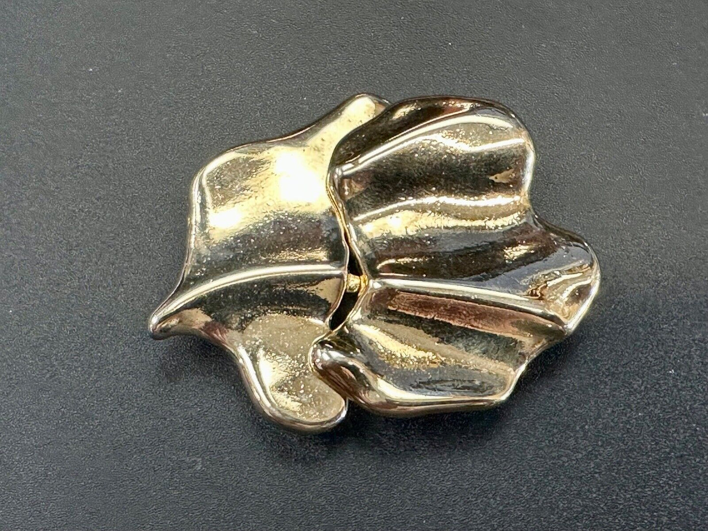 Two-piece interlocking gold tone leaf swirl theme belt slide buckle signed _____