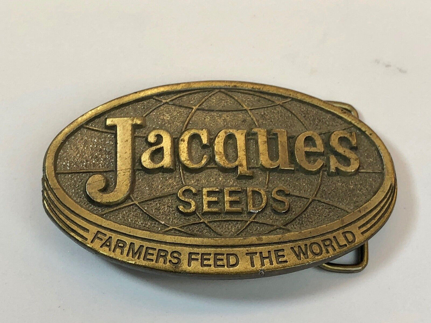 1970’s Jacques Seeds belt buckle farmers feed the world. Limited ED. Lewis