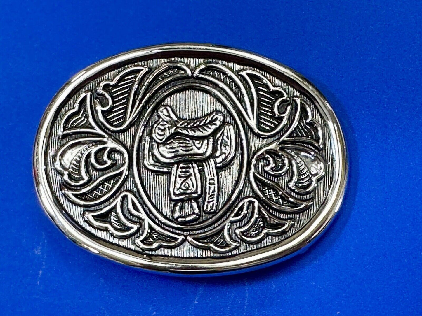 Vintage Cowboy's Horse Saddle ornate flower swirl oval belt buckle by Avon