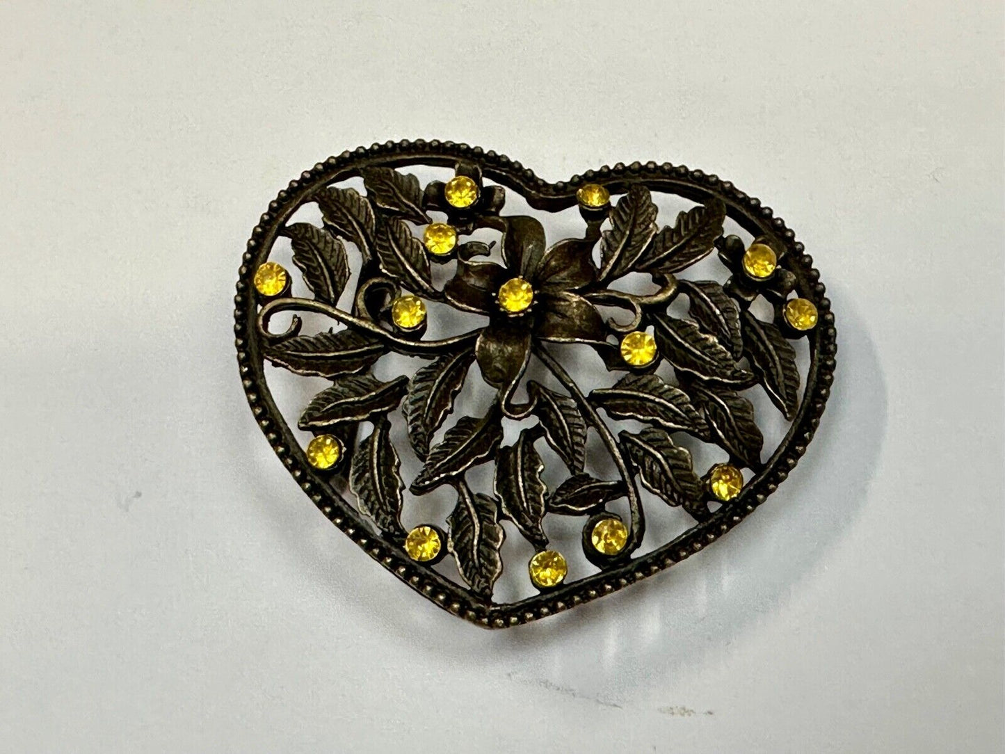 Beautiful see through Heart shaped belt buckle with yellow rhinestone accents