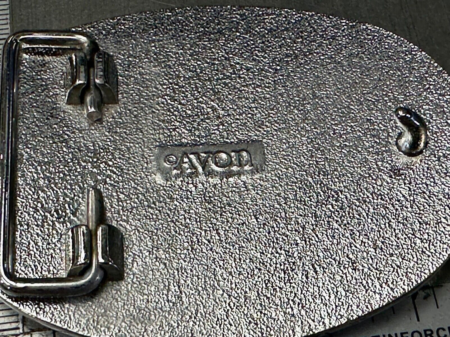 Vintage Cowboy's Horse Saddle ornate flower swirl oval belt buckle by Avon