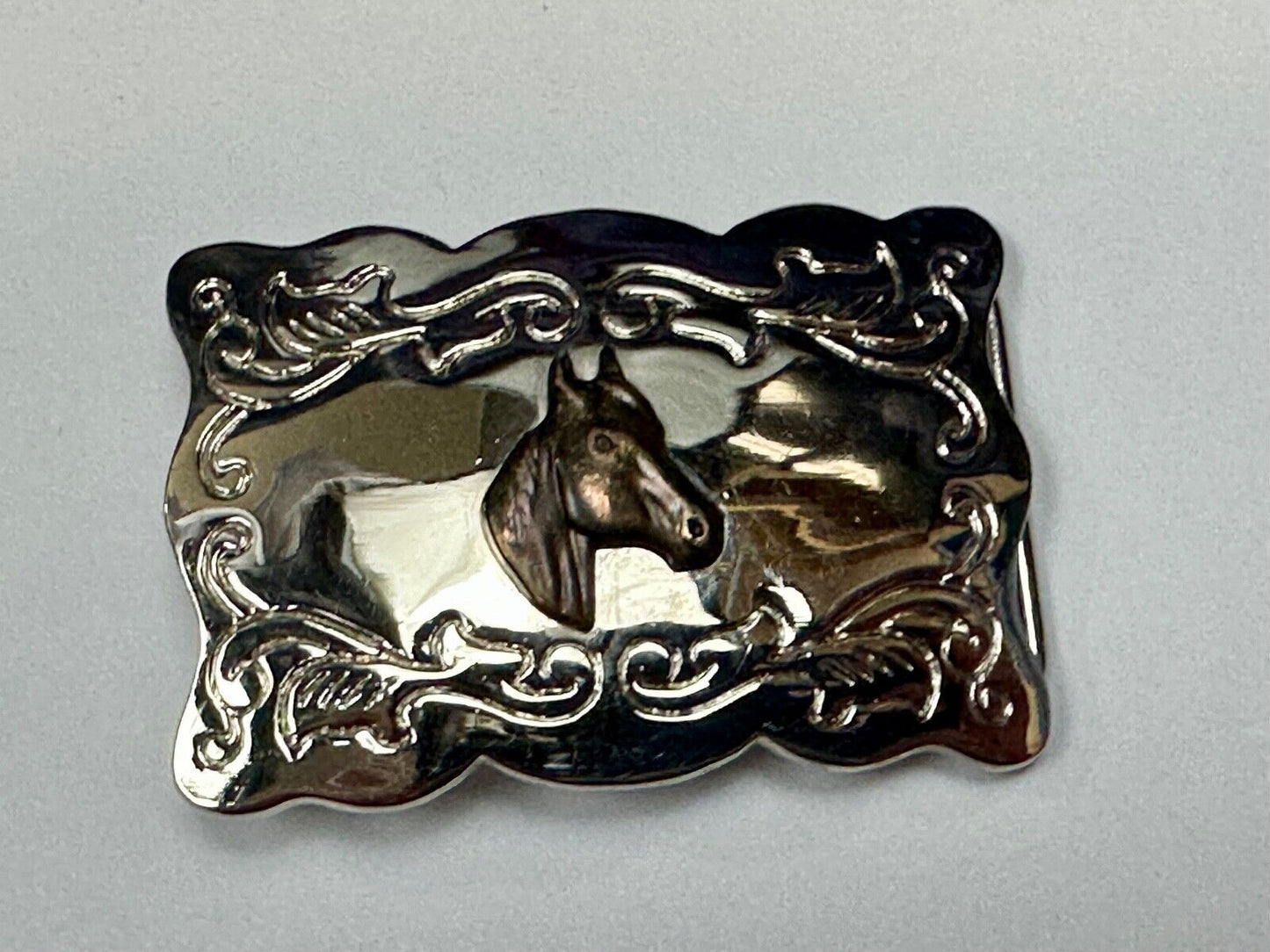 Vintage horse head centered on western rectangular two tone belt buckle