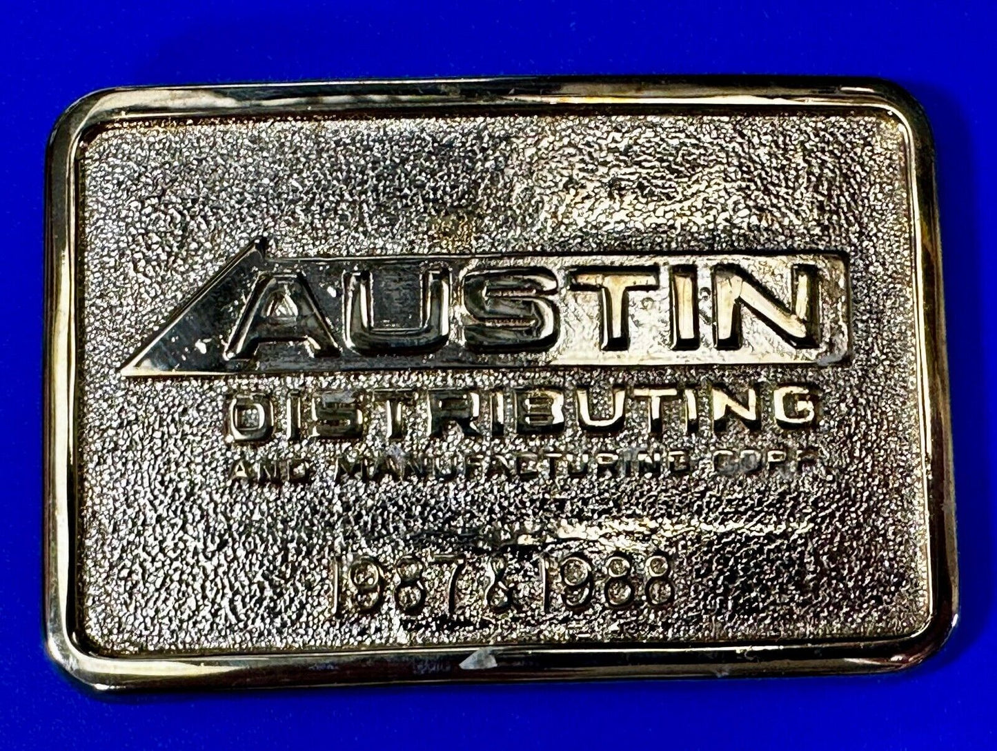 Austin Texas Distributing and Manufacturing 1987 Gold Tone Belt Buckle