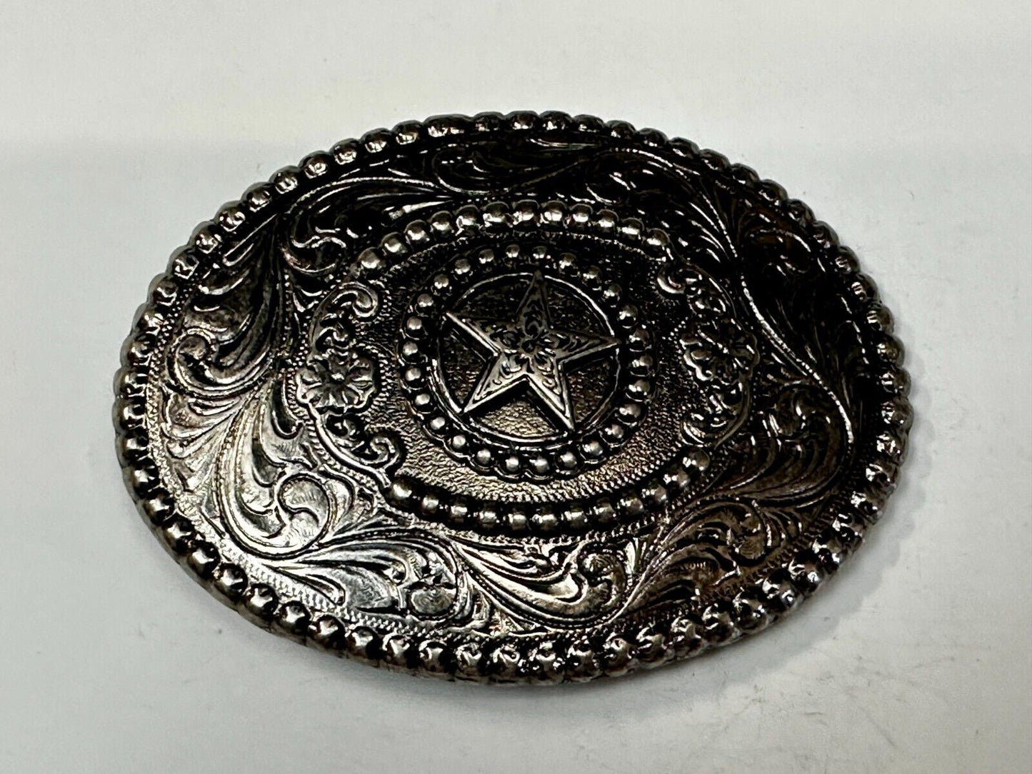 The Lone Star Centered In Oval Flower Swirl Silver Tone Belt Buckle