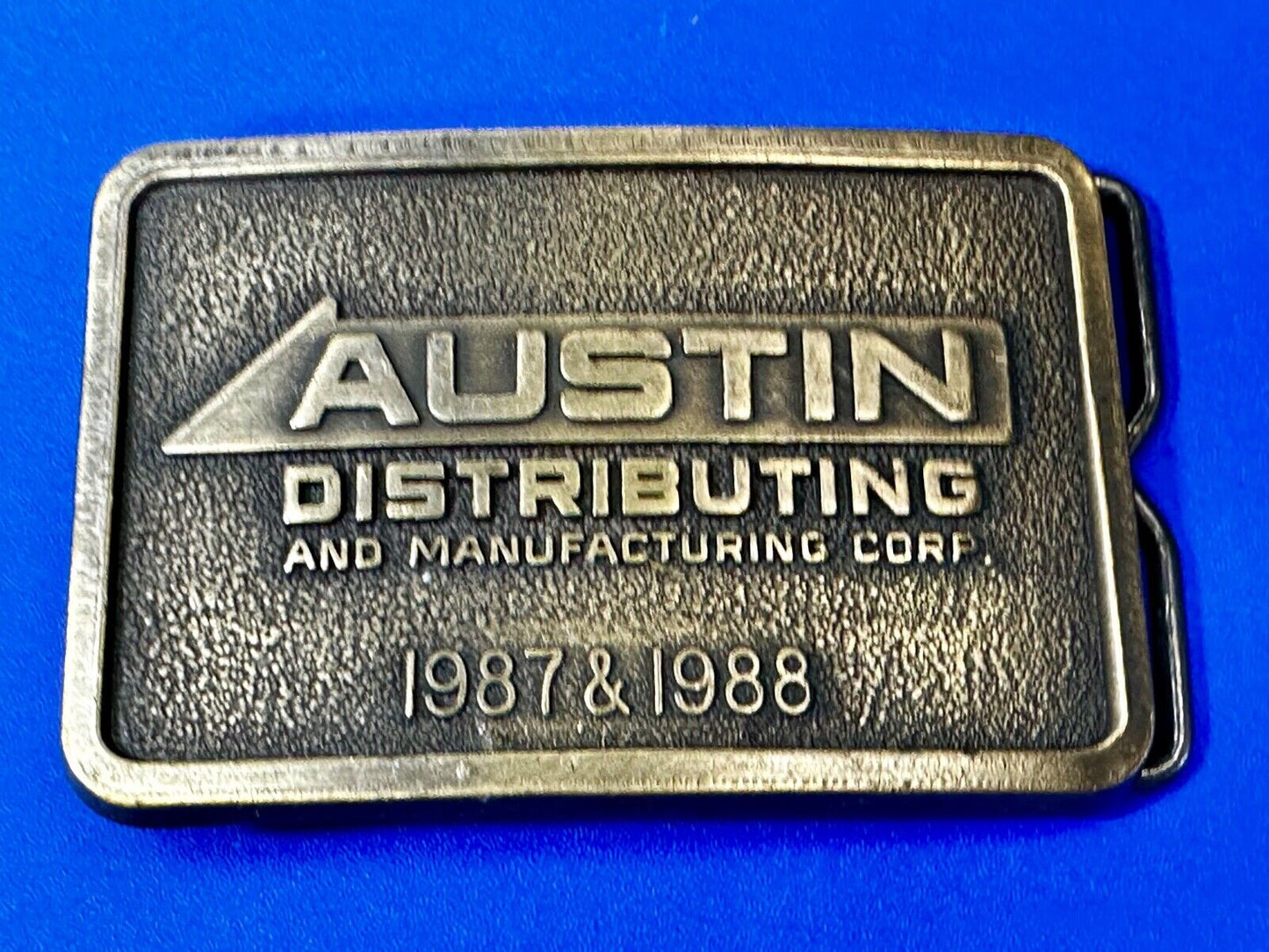 Austin Texas Distributing and Manufacturing 1987 Advertisement Promo Belt Buckle