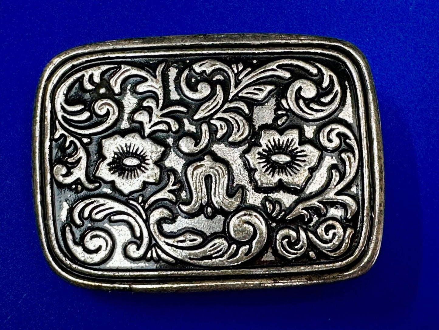 Vintage black and silver tone western flower floral theme cowboys belt buckle