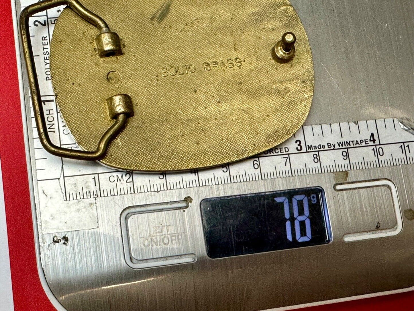 Artisan jumping fish on snake skin solid brass belt buckle