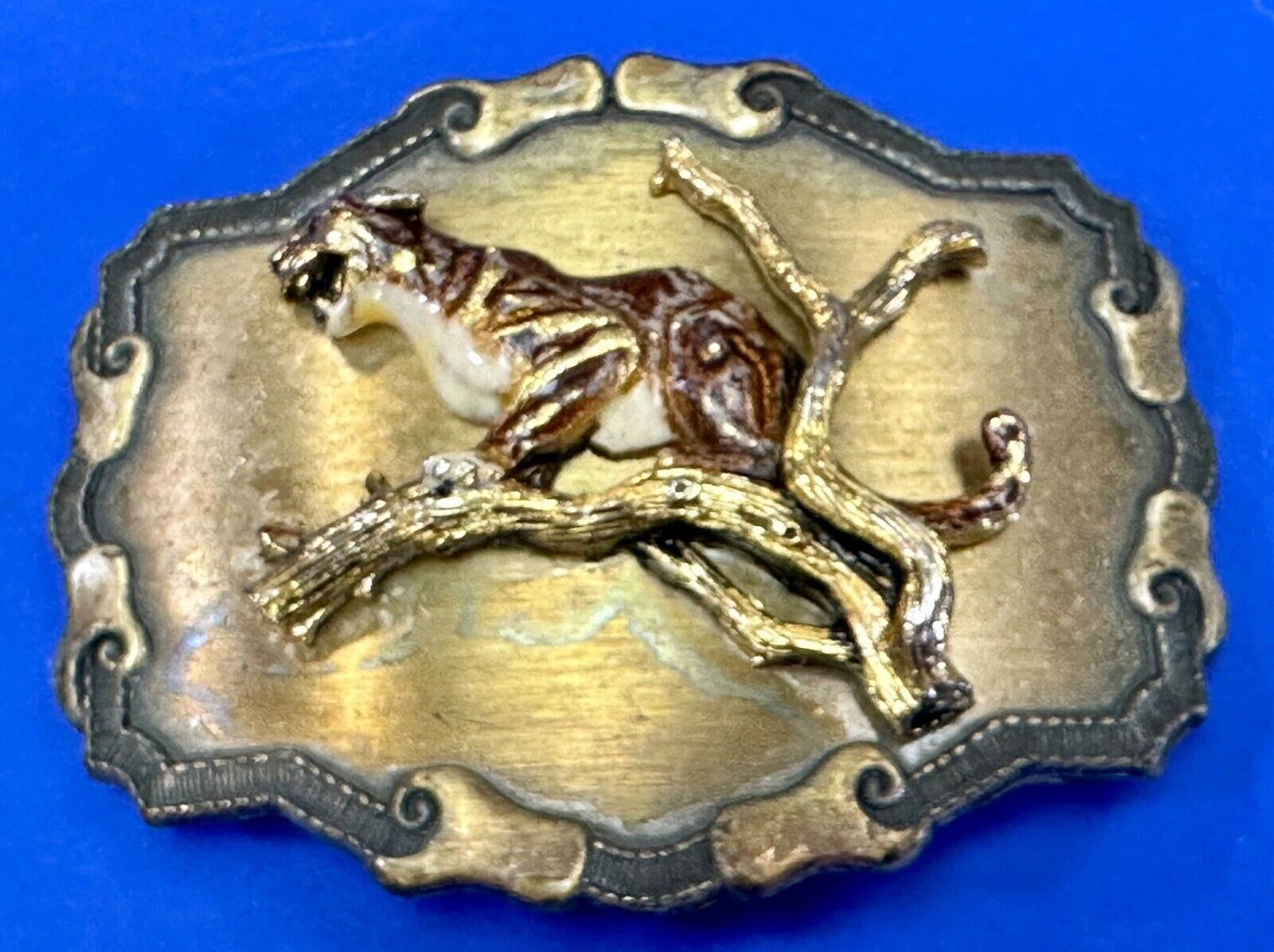 Vintage bobcat? leaping from branch western framed belt buckle by Raintree