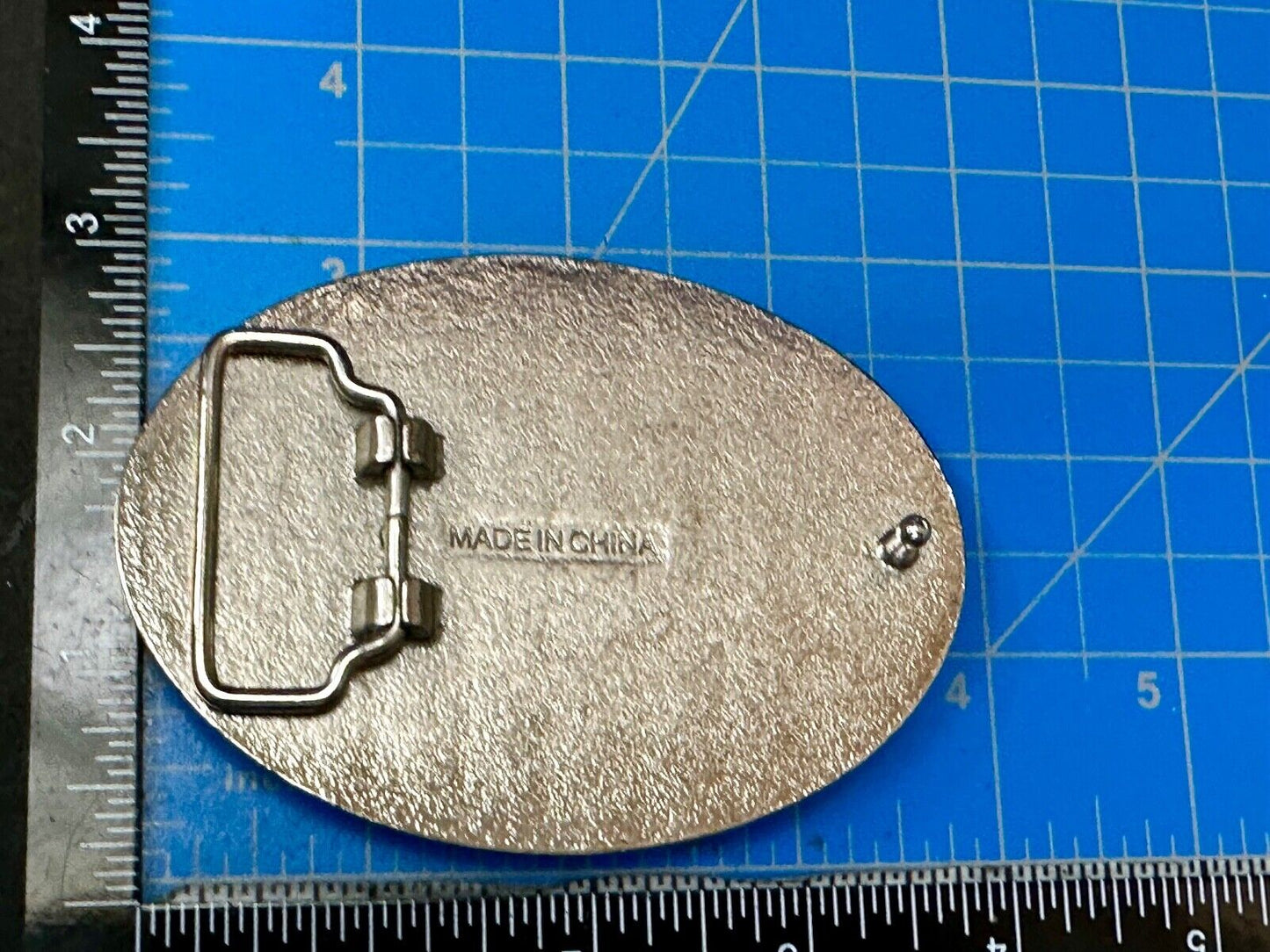Black and silver Belt Buckle with multiple skulls on boarder