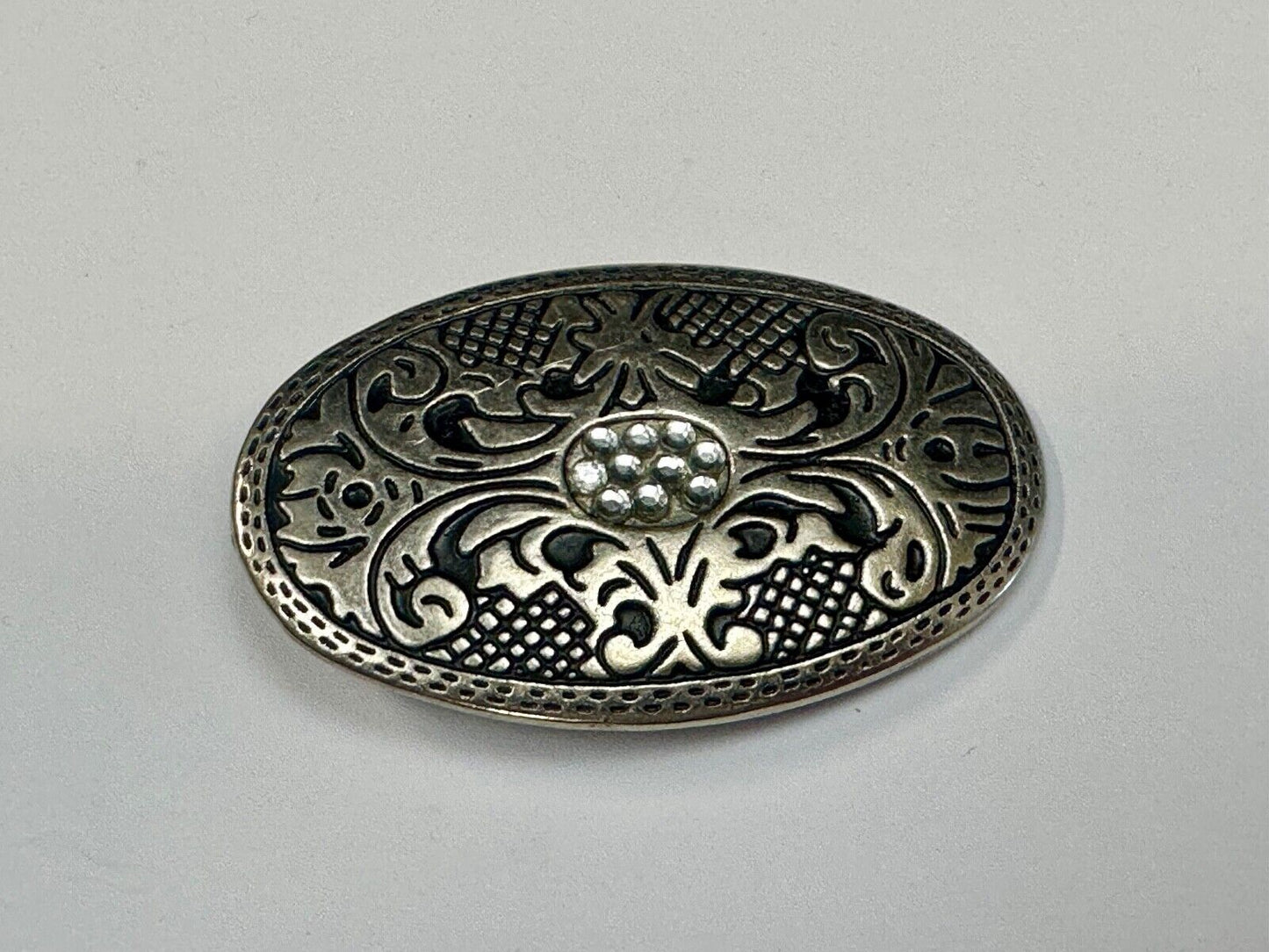 Vintage Cluster Centered in southwestern pattern oval belt buckle