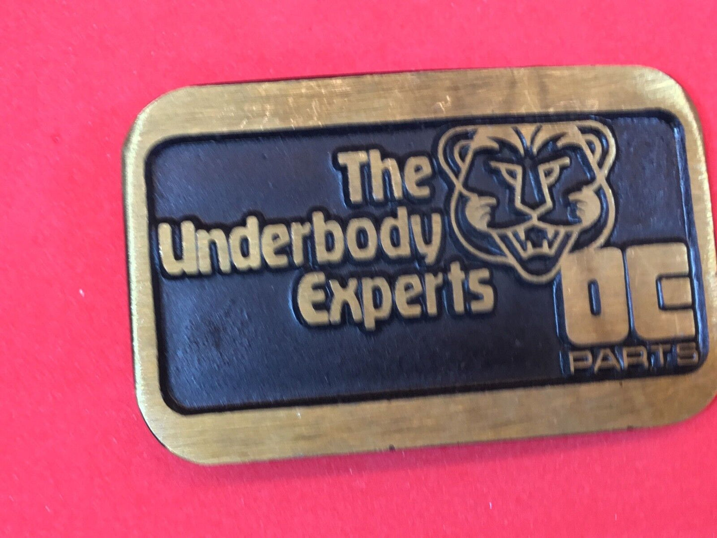 The Underbody Experts DE Parts auto car logo Promo belt buckle by Dynabuckle