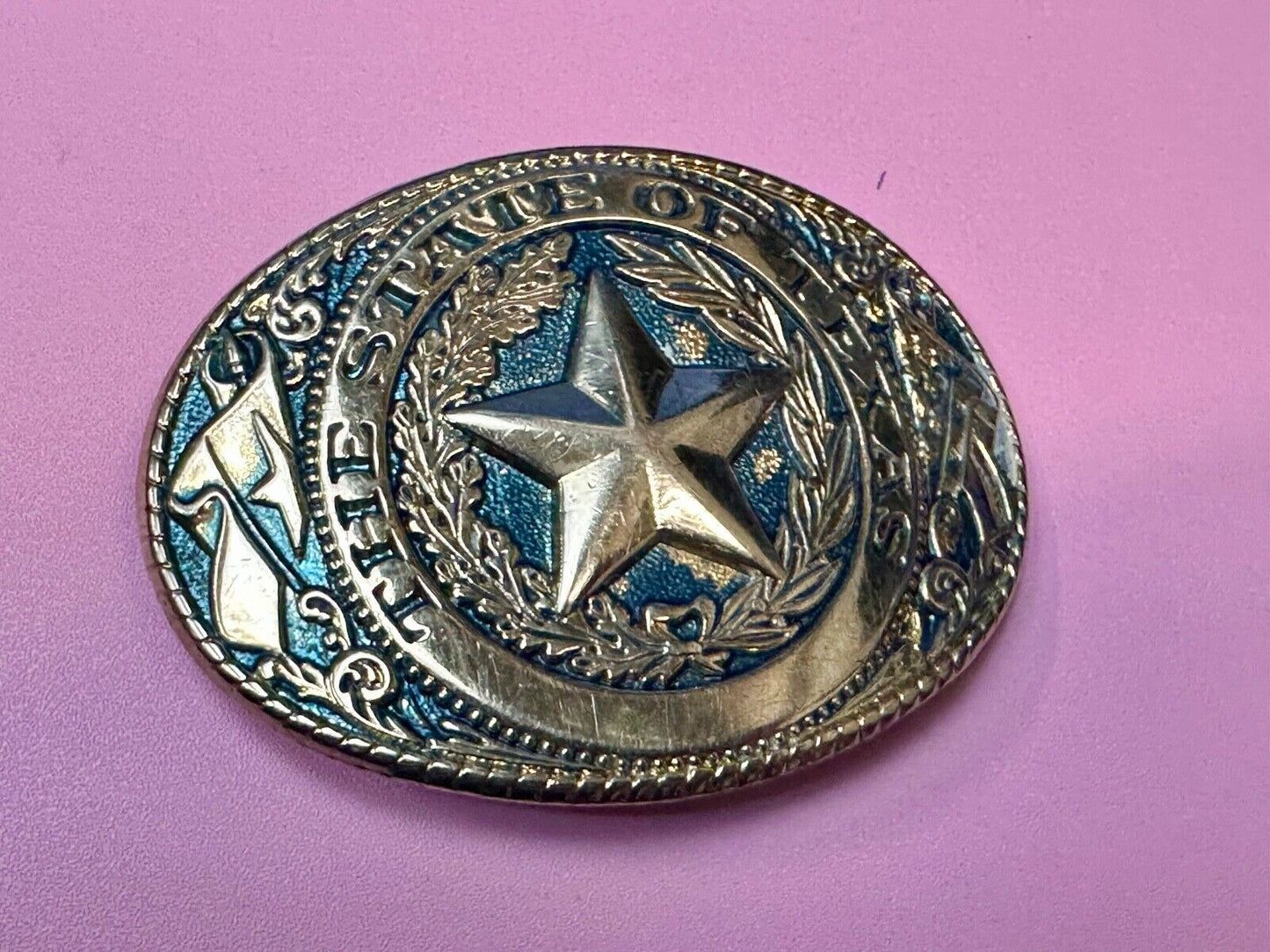 The Great State of Texas - gold color star belt buckle with blue colored accents