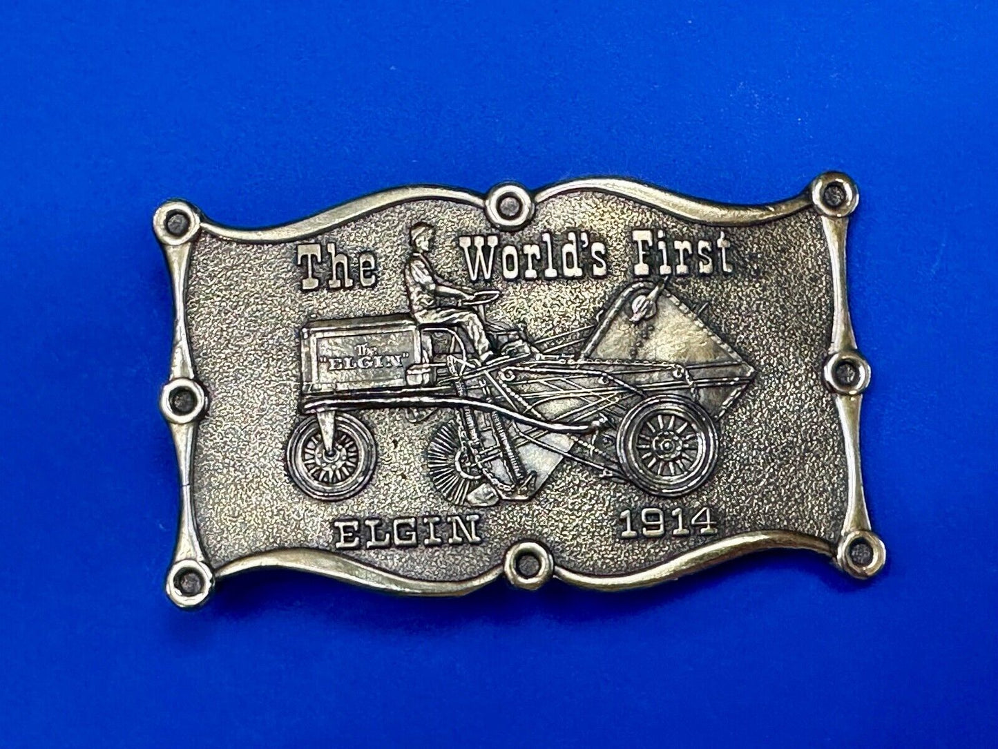 The Elgin, The worlds first tree sweeper commemorative belt buckle by Lewis