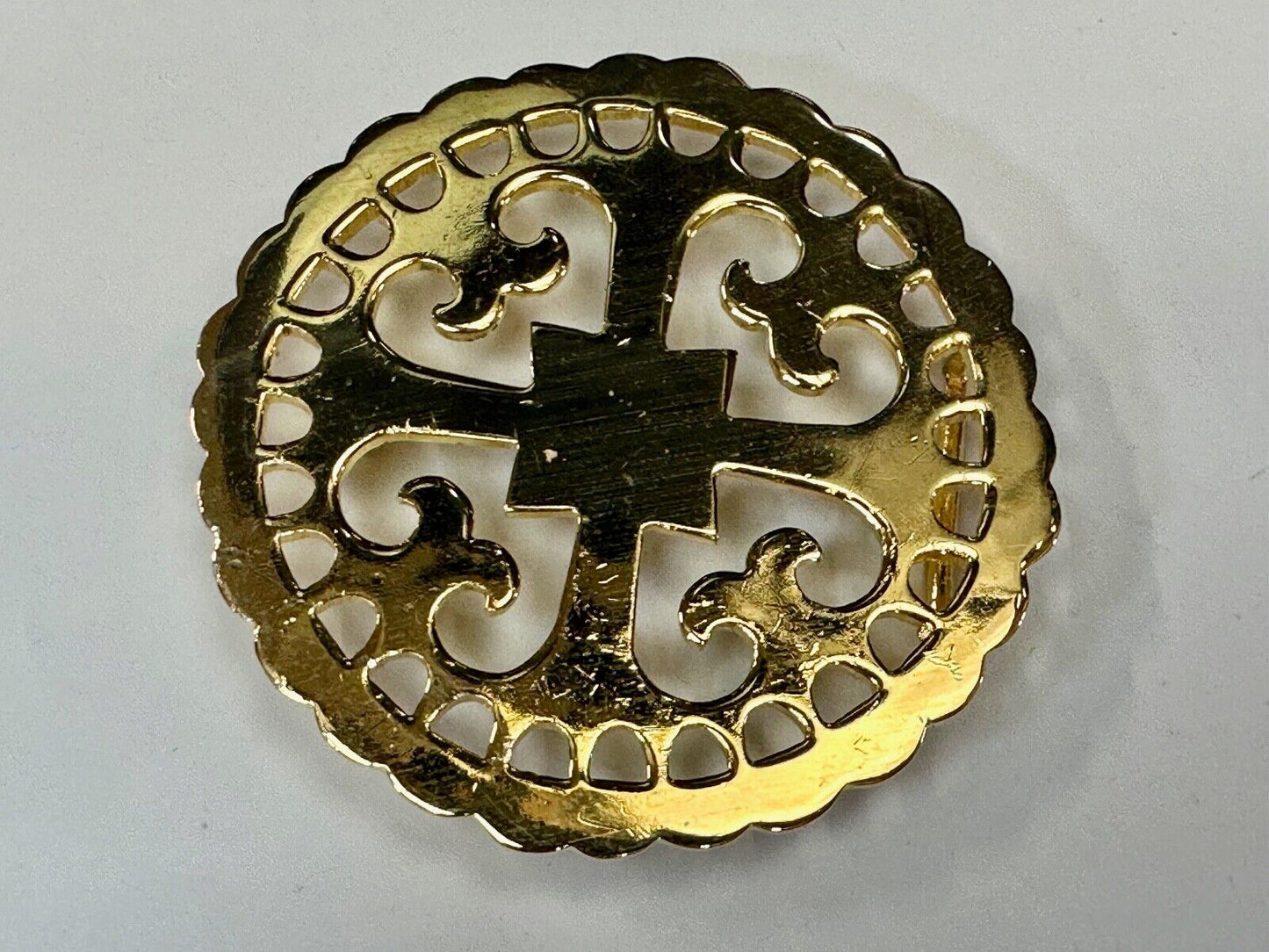 vintage Celtic pattern round cutout belt buckle by designer Ann Lansing