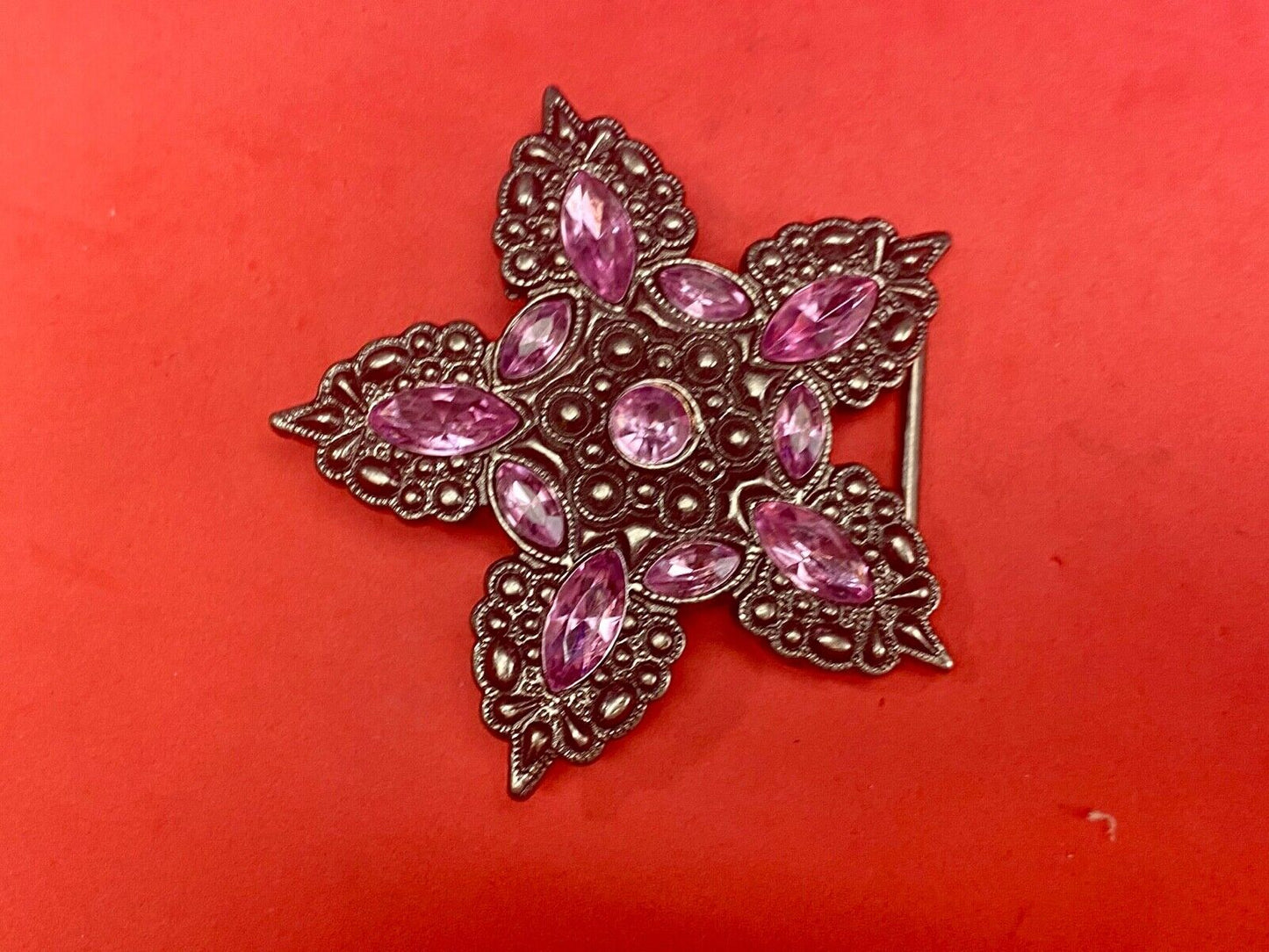 Beautiful figural star with pink accent rhinestones